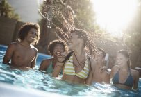 Friends in the swimming pool — Stock Photo