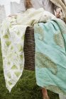 Basket overflowing with household linens — Stock Photo