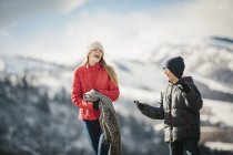 Brother and sister together outdoors in winter — Stock Photo