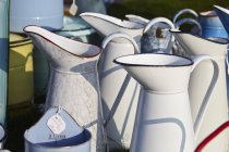 Enamel jugs for sale. — Stock Photo