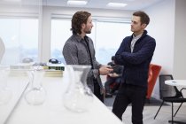 Two men in an office — Stock Photo