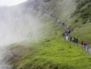 Hikers on the track towards the Gullfoss waterfall — Stock Photo