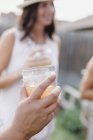 Hand holding a drink — Stock Photo