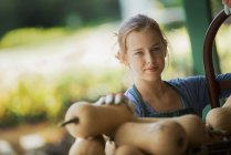 Girl carrying squash vegetables. — Stock Photo