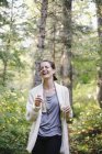 Woman standing in a glade — Stock Photo