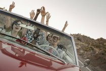 Friends in convertable car on a road trip. — Stock Photo