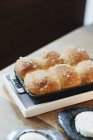 Tray of freshly baked bread rolls — Stock Photo