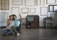 Couple taking a selfy in their home. — Stock Photo