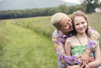 Woman and girl in meadow — Stock Photo