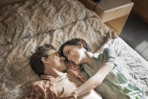 Couple lying side by side — Stock Photo