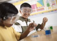 Boy and girl on a science lesson — Stock Photo