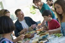 Adults and children on family party in a cafe. — Stock Photo