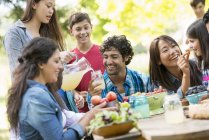 Adults and children eating — Stock Photo