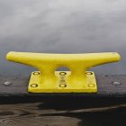 Large yellow mooring cleat — Stock Photo