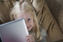 Girl holding a laptop — Stock Photo