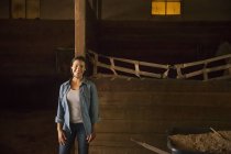 Woman in horse stable — Stock Photo
