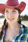 Woman in a pink straw hat — Stock Photo