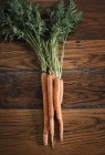 Small bunch of carrots on tabletop — Stock Photo