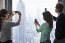 People take images of the city — Stock Photo