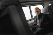 Mature man in train — Stock Photo