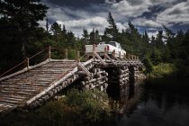 Wooden Bridge with Light Truck — Stock Photo