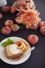 Peach cake with a serving of creme fraiche — Stock Photo