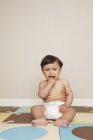 Baby boy in a diaper crying. — Stock Photo