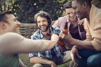 Group of friends having a beer. — Stock Photo