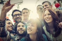 Friends gathering to take a group selfie. — Stock Photo