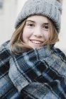 Teenage girl in a tartan plaid shawl — Stock Photo