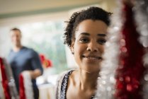 Woman decorating a house at Christmas. — Stock Photo