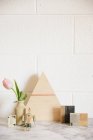 Stone worktop with a wooden triangle of wood — Stock Photo