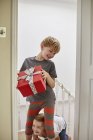 Children on Christmas morning at home. — Stock Photo