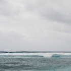 Turquoise water and an overcast sky — Stock Photo