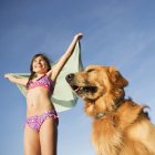 Golden retriever dog and girl — Stock Photo