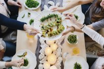 Overhead view of people sharing meal — Stock Photo