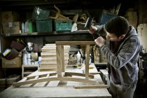Man working in a furniture maker 's workshop — стоковое фото