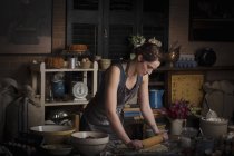 Woman preparing dough for biscuits — Stock Photo