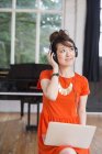 Woman wearing headphones in rehearsal studio — Stock Photo