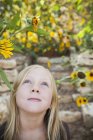 Young girl looking up — Stock Photo