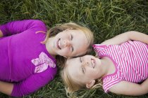 Portrait of two sisters smiling — Stock Photo