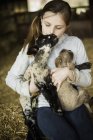 Girl and newborn lambs — Stock Photo