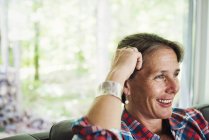 Woman at home smiling — Stock Photo