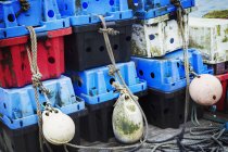 Fish boxes and fishing floats. — Stock Photo
