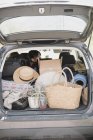 Estate car trunk full of bags — Stock Photo