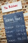 Blackboard with trading hours — Stock Photo