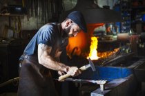 Blacksmith uses complex tools — Stock Photo