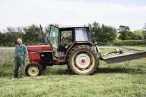 Stationary red tractor — Stock Photo