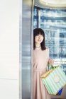Woman carrying shopping bags. — Stock Photo