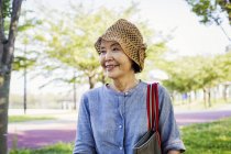 Senior woman wearing a crochet hat. — Stock Photo